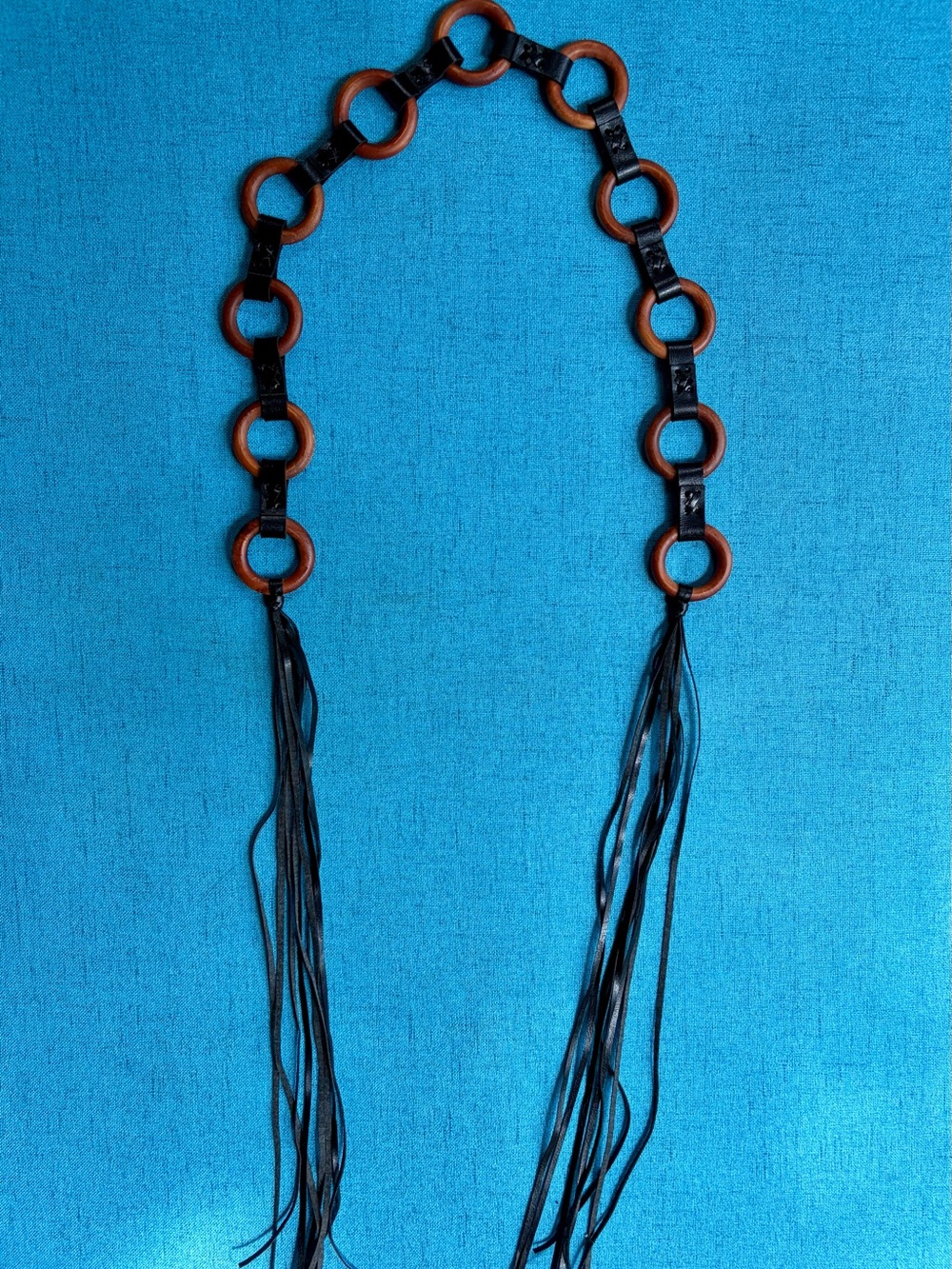 Brown leather fringe belt with wooden circular links and tassels #boho #western